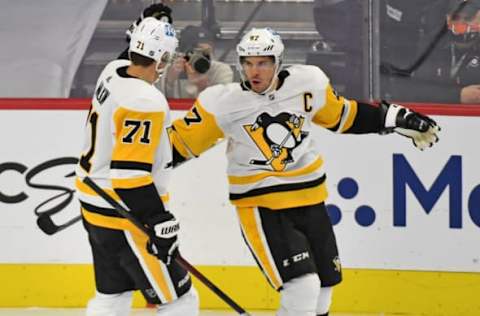 Jan 13, 2021; Philadelphia, Pennsylvania, USA; Pittsburgh Penguins center Sidney Crosby (87) celebrates his goal with Pittsburgh Penguins center Evgeni Malkin (71) against the Philadelphia Flyers during the second period at Wells Fargo Center. Mandatory Credit: Eric Hartline-USA TODAY Sports