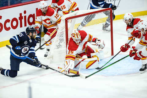 Winnipeg Jets, Matthieu Perreault (85), Calgary Flames, Jacob Markstrom (25) Mandatory Credit: Terrence Lee-USA TODAY Sports