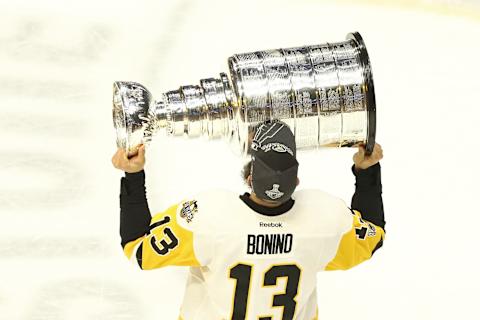 Jun 11, 2017; Nashville, TN, USA; Pittsburgh Penguins center Nick Bonino (13) skates with the Stanley Cup after defeating the Nashville Predators in game six of the 2017 Stanley Cup Final at Bridgestone Arena. Mandatory Credit: Aaron Doster-USA TODAY Sports