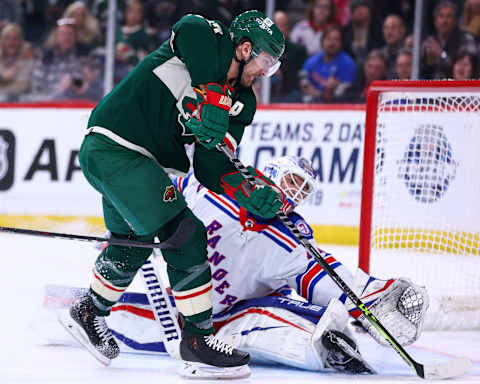 Mar 8, 2022; Saint Paul, Minnesota, USA; Minnesota Wild left wing Marcus Foligno (17) scores a goal against the New York Rangers during the second period at Xcel Energy Center. Mandatory Credit: Harrison Barden-USA TODAY Sports