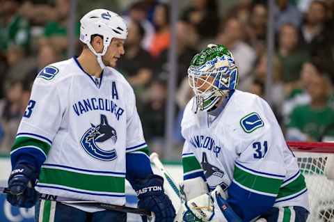 Oct 21, 2014; Dallas, TX, USA; Vancouver Canucks defenseman Kevin Bieksa (3) and goalie Eddie Lack (31) during the game against the Dallas Stars at the American Airlines Center. The Stars defeated the Canucks 6-3. Mandatory Credit: Jerome Miron-USA TODAY Sports