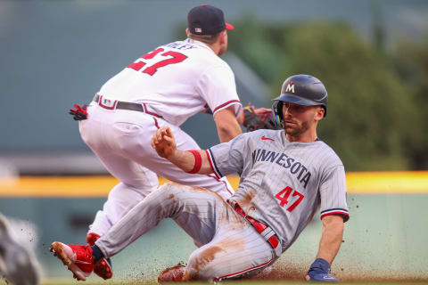 Edouard Julien slides into third.  Brett Davis-USA TODAY Sports