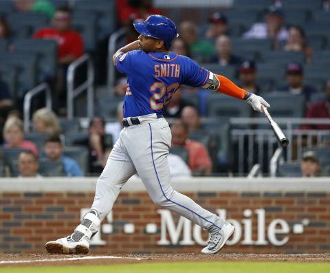 ATLANTA, GA – JUNE 12: First baseman Dominic Smith #22 of the New York Mets swings during the game against the Atlanta Braves at SunTrust Park on June 12, 2018 in Atlanta, Georgia. (Photo by Mike Zarrilli/Getty Images)