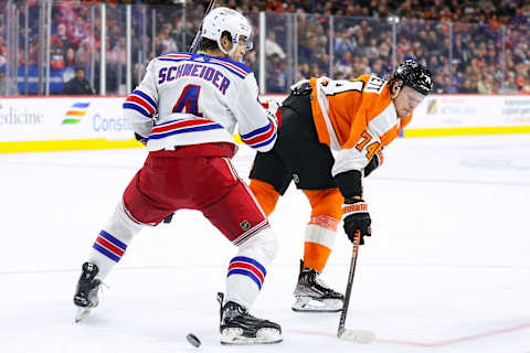 PHILADELPHIA, PENNSYLVANIA – MARCH 01: Braden Schneider #4 of the New York Rangers guards Owen Tippett #74 of the Philadelphia Flyers during overtime at Wells Fargo Center on March 01, 2023, in Philadelphia, Pennsylvania. (Photo by Tim Nwachukwu/Getty Images)