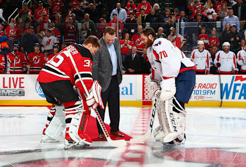 NEWARK, NJ – FEBRUARY 06: Former New Jersey Devil Martin Brodeur drops the ceremonial first puck between Cory Schneider #35 of the New Jersey Devils and Braden Holtby #70 of the Washington Capitals prior to the game at the Prudential Center on February 6, 2016 in Newark, New Jersey. (Photo by Andy Marlin/NHLI via Getty Images)