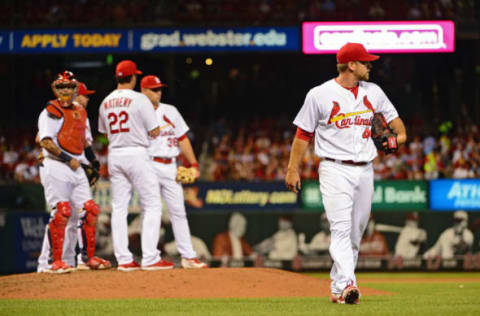 Jul 15, 2016; St. Louis, MO, USA; St. Louis Cardinals relief pitcher Trevor Rosenthal (44) is removed fro the game by manager Mike Matheny (22) during the seventh inning against the Miami Marlins at Busch Stadium. The Marlins won 7-6. Mandatory Credit: Jeff Curry-USA TODAY Sports. MLB.