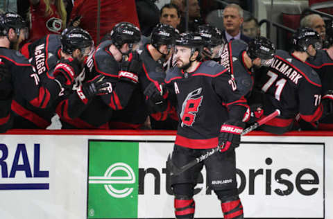 RALEIGH, NC – MAY 01: Carolina Hurricanes defenseman Justin Faulk (27) celebrates with teammates after scoring in the second period during a game between the Carolina Hurricanes and the New York Islanders on May 1, 2019 at the PNC Arena in Raleigh, NC. (Photo by Greg Thompson/Icon Sportswire via Getty Images)