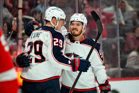 DETROIT, MICHIGAN – JANUARY 14: Patrik Laine #29, Johnny Gaudreau #13 and Jack Roslovic #96 of the Columbus Blue Jackets celebrate a goal scored by Laine against the Detroit Red Wings during the first period of the game at Little Caesars Arena on January 14, 2023 in Detroit, Michigan. (Photo by Nic Antaya/Getty Images)