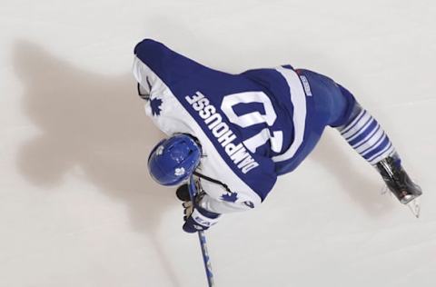 TORONTO – NOVEMBER 14: John Mitchell #39 of the Toronto Maple Leafs wearing a throw back Vincent Damphousse jersey shoots the puck during warm up prior to a game against the Calgary Flames November 14, 2009 at the Air Canada Centre in Toronto, Ontario, Canada. (Photo by Graig Abel/NHLI via Getty Images)