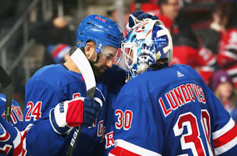 NEWARK, NJ – JANUARY 31: Henrik Lundqvist #30 of the New York Rangers is congratulated by Boo Nieves #24 after defeating the New Jersey Devils at Prudential Center on January 31, 2019 in Newark, New Jersey. (Photo by Andy Marlin/NHLI via Getty Images)