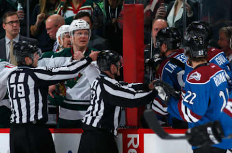 DENVER, CO – FEBRUARY 28: Linesmen Kiel Murchison #79 and Vaughan Rody #73 seperate captains Mikko Koivu #9 of the Minnesota Wild and Gabriel Landeskog #92 of the Colorado Avalanche on the bench late in the game as Landeskog was given a 10 minute misconduct penalty with four second remaining in the game at Pepsi Center on February 28, 2015 in Denver, Colorado. The Wild defeated the Avalanche 3-1. (Photo by Doug Pensinger/Getty Images)