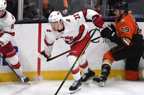 ANAHEIM, CA – OCTOBER 18: Carolina Hurricanes defenseman Brett Pesce (22) chases the puck during the second period of a game against the Anaheim Ducks played on October 18, 2019 at the Honda Center in Anaheim, CA. (Photo by John Cordes/Icon Sportswire via Getty Images)