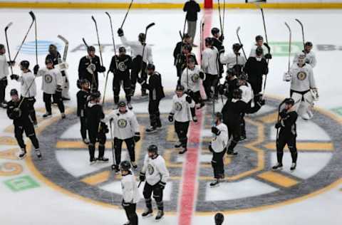 BOSTON, MA – MAY 23: The Boston Bruins stand at center ice as they salute the fans at the end of a scrimmage ahead of the start of the 2019 NHL Stanley Cup Finals at TD Garden in Boston on May 23, 2019. (Photo by John Tlumacki/The Boston Globe via Getty Images)