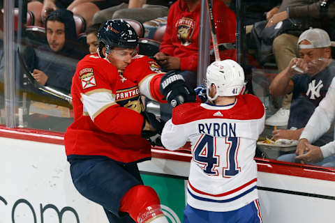 SUNRISE, FL – MARCH 29: Ben Chiarot #8 of the Florida Panthers and Paul Byron #41 of the Montreal Canadiens battle behind the net during first-period action at the FLA Live Arena on March 29, 2022 in Sunrise, Florida. (Photo by Joel Auerbach/Getty Images)