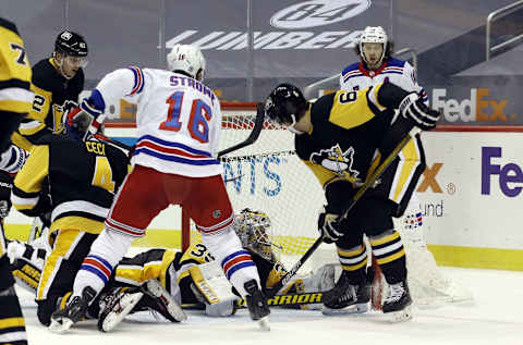 Jan 24, 2021; Pittsburgh, Pennsylvania, USA; New York Rangers center Ryan Strome (16) scores a goal against Pittsburgh Penguins goaltender Tristan Jarry (35) during the second period at the PPG Paints Arena. Mandatory Credit: Charles LeClaire-USA TODAY Sports