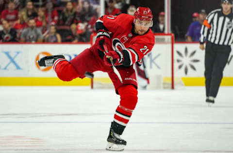 RALEIGH, NC – SEPTEMBER 29: Carolina Hurricanes right wing Nino Niederreiter (21) shoots the puck into the zone during an NHL Preseason game between the Washington Capitals and the Carolina Hurricanes on September 29, 2019 at the PNC Arena in Raleigh, NC. (Photo by Greg Thompson/Icon Sportswire via Getty Images)