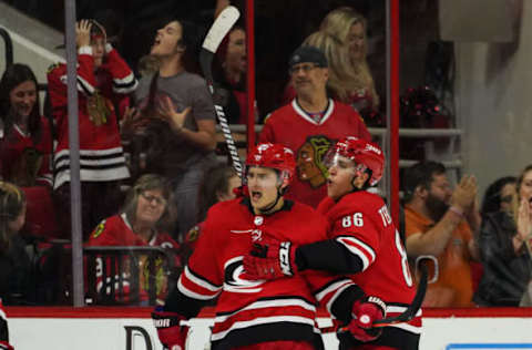 RALEIGH, NC – NOVEMBER 12: Carolina Hurricanes Center Sebastian Aho (20) celebrates after the game winning goal during a game between the Chicago Blackhawks and the Carolina Hurricanes at the PNC Arena in Raleigh, NC on November 12, 2018. (Photo by Greg Thompson/Icon Sportswire via Getty Images)