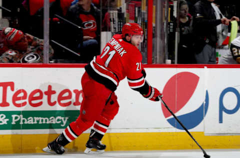 RALEIGH, NC – JANUARY 21: Lee Stempniak #21 of the Carolina Hurricanes skates with the puck along the boards during an NHL game against the Vegas Golden Knights on January 21, 2018 at PNC Arena in Raleigh, North Carolina. (Photo by Gregg Forwerck/NHLI via Getty Images)