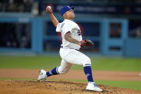 Apr 4, 2023; Los Angeles, California, USA; Los Angeles Dodgers starting pitcher Julio Urias (7) throws in the third inning against the Colorado Rockies at Dodger Stadium. Mandatory Credit: Kirby Lee-USA TODAY Sports