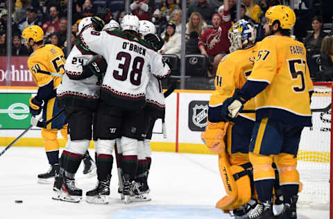 Nov 11, 2023; Nashville, Tennessee, USA; Arizona Coyotes players celebrate after a goal by center Alexander Kerfoot (15) during the second period against the Nashville Predators at Bridgestone Arena. Mandatory Credit: Christopher Hanewinckel-USA TODAY Sports