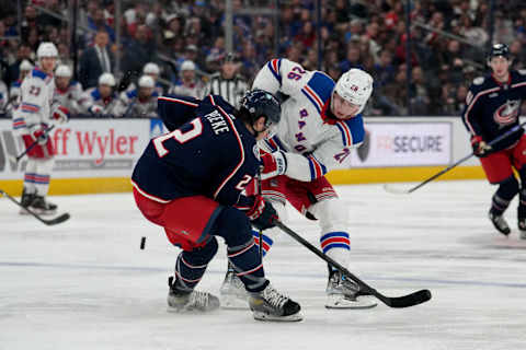 COLUMBUS, OHIO – APRIL 08: Jimmy Vesey #26 of the New York Rangers shoots the puck while Andrew Peeke #2 of the Columbus Blue Jackets defends during the third period of the game at Nationwide Arena on April 08, 2023 in Columbus, Ohio. (Photo by Jason Mowry/Getty Images)