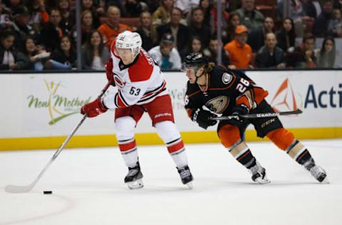 ANAHEIM, CA – DECEMBER 11: Jeff Skinner #53 of the Carolina Hurricanes battles Carl Hagelin #26 of the Anaheim Ducks for a loose puck during a game at Honda Center. (Photo by Sean M. Haffey/Getty Images)