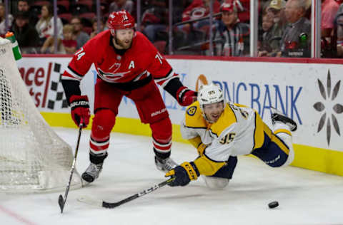 RALEIGH, NC – SEPTEMBER 27: Nashville Predators center Matt Duchene (95) falls as he and Carolina Hurricanes defenseman Jaccob Slavin (74) attempt to play the loose puck during an NHL Pre-Season game between the Carolina Hurricanes and the Nashville Predators on September 27, 2019 at the PNC Arena in Raleigh, NC. (Photo by John McCreary/Icon Sportswire via Getty Images)