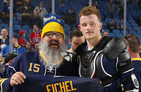 BUFFALO, NY – APRIL 05: Jack Eichel of the Buffalo Sabres, right, gives his jersey to a fan after their NHL game against the Montreal Canadiens at KeyBank Center on April 5, 2017 in Buffalo, New York. (Photo by Bill Wippert/NHLI via Getty Images)