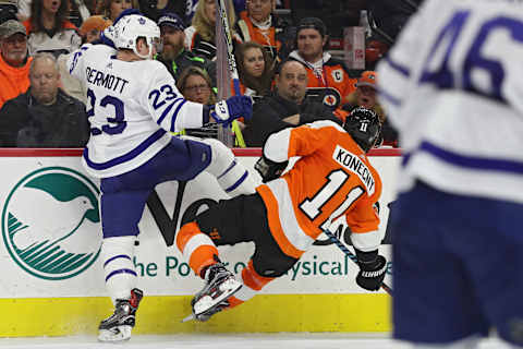 Travis Dermott #23 of the Toronto Maple Leafs checks Travis Konecny #11 of the Philadelphia Flyers during the second period at Wells Fargo Center on January 18, 2018 in Philadelphia, Pennsylvania. (Photo by Patrick Smith/Getty Images)