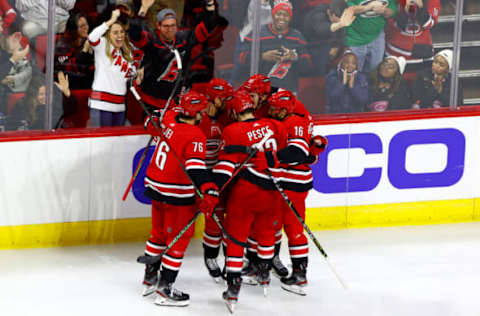 RALEIGH, NORTH CAROLINA – DECEMBER 16: The Carolina Hurricanes celebrate a goal by Nino Niederreiter #21 of the Carolina Hurricanes during the third period of the game against the Detroit Red Wings at PNC Arena on December 16, 2021, in Raleigh, North Carolina. (Photo by Jared C. Tilton/Getty Images)