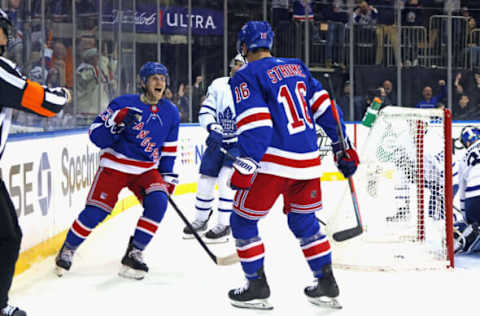 NEW YORK, NEW YORK – JANUARY 19: Adam Fox #23 of the New York Rangers (L) celebrates his second-period goal against the Toronto Maple Leafs and is joined by Ryan Strome #16 (R) at Madison Square Garden on January 19, 2022, in New York City. (Photo by Bruce Bennett/Getty Images)