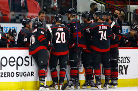 RALEIGH, NORTH CAROLINA – JUNE 01: Head coach Rod Brind’Amour of the Carolina Hurricanes speaks with his team during the third period in Game Two of the Second Round of the 2021 Stanley Cup Playoffs against the Tampa Bay Lightning at PNC Arena on June 01, 2021, in Raleigh, North Carolina. (Photo by Jared C. Tilton/Getty Images)