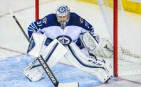 Mar 16, 2016; Calgary, Alberta, CAN; Winnipeg Jets goalie Ondrej Pavelec (31) guards his net against the Calgary Flames during the second period at Scotiabank Saddledome. Calgary Flames won 4-1. Mandatory Credit: Sergei Belski-USA TODAY Sports