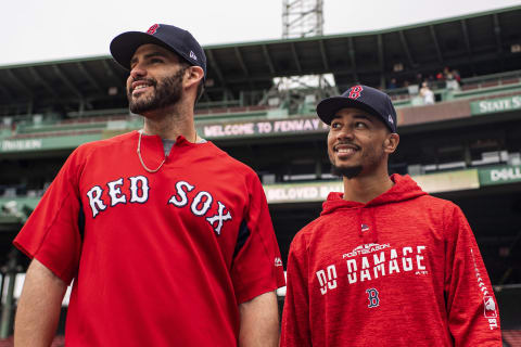 BOSTON, MA – OCTOBER 3: J.D. Martinez #28 and Mookie Betts #50 of the Boston Red Sox look on during a workout before the American League Division Series on October 3, 2018 at Fenway Park in Boston, Massachusetts. (Photo by Billie Weiss/Boston Red Sox/Getty Images)