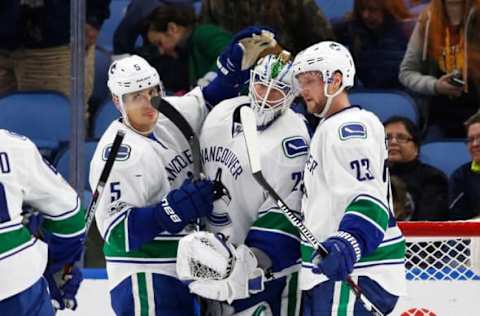 NHL Power Rankings: Vancouver Canucks goalie Jacob Markstrom (25) is congratulated by teammates after beating the Buffalo Sabres at KeyBank Center. The Canucks beat the Sabres 4-2. Mandatory Credit: Kevin Hoffman-USA TODAY Sports