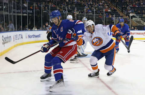 NEW YORK, NEW YORK – SEPTEMBER 26: Cole Bardreau #54 of the New York Islanders skates against Jacob Trouba #8 of the New York Rangers during the third period at Madison Square Garden on September 26, 2022, in New York City. The Rangers defeated the Islanders 4-1. (Photo by Bruce Bennett/Getty Images)