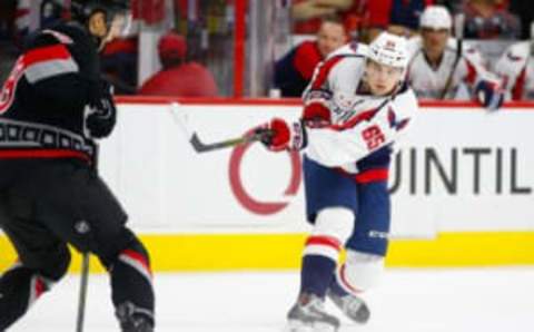 Dec 31, 2015; Raleigh, NC, USA; Washington Capitals forward Andre Burakovsky (65) watches his shot against the Carolina Hurricanes at PNC Arena. The Carolina Hurricanes defeated the Washington Capitals 4-2. Mandatory Credit: James Guillory-USA TODAY Sports