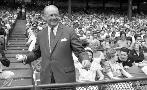 NEW YORK, NY – AUGUST 9, 1969: Former pitcher, Waite Hoyt of the New York Yankees, gets set to throw out the ceremonial first pitch during the annual Old Timers Day ceremonies prior to a game on August 9, 1969…seated to Hoyt’s left are Mrs. Babe (Claire) Ruth and Mrs. Lou (Eleanor) Gehrig. (Photo by Diamond Images/Getty Images)