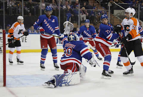 NEW YORK, NEW YORK – MARCH 01: Henrik Lundqvist #30 of the New York Rangers makes a third period save on Ivan Provorov #9 of the Philadelphia Flyers at Madison Square Garden on March 01, 2020 in New York City. The Flyers defeated the Rangers 5-3. (Photo by Bruce Bennett/Getty Images)