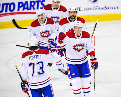 CALGARY, AB – MARCH 11: Corey Perry #94 (R) of the Montreal Canadiens celebrates with his teammates after scoring against the Calgary Flames during an NHL game at Scotiabank Saddledome on March 11, 2021 in Calgary, Alberta, Canada. (Photo by Derek Leung/Getty Images)