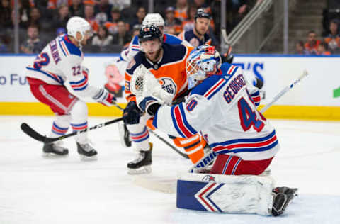 EDMONTON, AB – MARCH 11: Josh Currie #43 of the Edmonton Oilers takes a shot on goaltender Alexandar Georgiev #40 of the New York Rangers during the second period at Rogers Place on March 11, 2019 in Edmonton, Alberta, Canada. (Photo by Codie McLachlan/Getty Images)