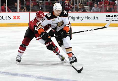 GLENDALE, AZ – MARCH 05: Lawson Crouse #67 of the Arizona Coyotes reaches in to knock the puck away from Brendan Guhle #2 of the Anaheim Ducks during the second period at Gila River Arena on March 5, 2019, in Glendale, Arizona. (Photo by Norm Hall/NHLI via Getty Images)