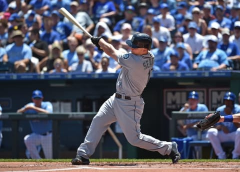 Jul 10, 2016; Kansas City, MO, USA; Seattle Mariners third basemen Kyle Seager (15) singles in two runs against the Kansas City Royals during the first inning at Kauffman Stadium. Mandatory Credit: Peter G. Aiken-USA TODAY Sports