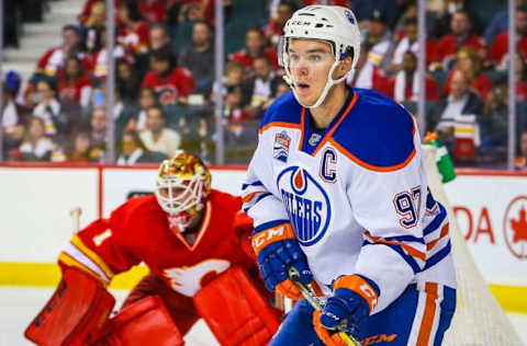 Oct 14, 2016; Calgary, Alberta, CAN; Edmonton Oilers center Connor McDavid (97) screens in front of Calgary Flames goalie Brian Elliott (1) during the second period at Scotiabank Saddledome. Mandatory Credit: Sergei Belski-USA TODAY Sports