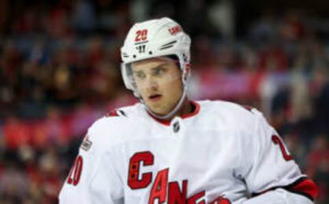 CALGARY, CANADA – OCTOBER 22: Sebastian Aho #20 of the Carolina Hurricanes prepares for a face-off during the game against the Calgary Flames at Scotiabank Saddledome on October 22, 2022 in Calgary, Alberta Canada. (Photo by Leah Hennel/Getty Images)