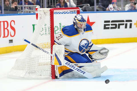 Mar 25, 2023; Elmont, New York, USA; Buffalo Sabres goaltender Eric Comrie (31) stops the puck in the second period against the New York Islanders at UBS Arena. Mandatory Credit: Wendell Cruz-USA TODAY Sports