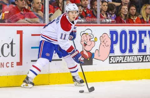 Oct 30, 2015; Calgary, Alberta, CAN; Montreal Canadiens right wing Brendan Gallagher (11) controls the puck against the Calgary Flames during the first period at Scotiabank Saddledome. Montreal Canadiens won 6-2. Mandatory Credit: Sergei Belski-USA TODAY Sports