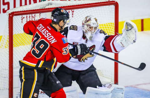 Nov 16, 2016; Calgary, Alberta, CAN; Arizona Coyotes goalie Mike Smith (41) guards his net as Calgary Flames right wing Alex Chiasson (39) tries to score during the third period at Scotiabank Saddledome. Calgary Flames won 2-1. Mandatory Credit: Sergei Belski-USA TODAY Sports