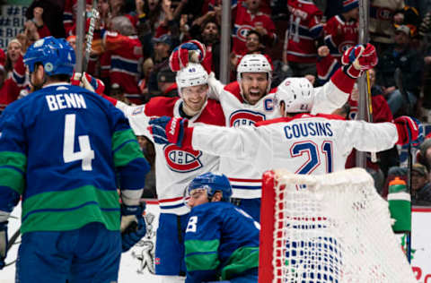 VANCOUVER, BC – DECEMBER 17: Shea Weber #6 of the Montreal Canadiens celebrates with teammates Joel Armia #40 and Nick Cousins #21 after scoring a goal while Jordie Benn #4 and Christopher Tanev #8 of the Vancouver Canucks look on during NHL action at Rogers Arena on December 17, 2019 in Vancouver, Canada. (Photo by Rich Lam/Getty Images)