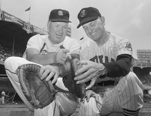 (Original Caption) 7/28/1962-New York, NY: Dizzy Dean (L) points out to Earl Averill, toe that liner off the bat of Averill broke during 1937 All-Star game. Scene took place during New York Yankees’ 16th Annual Old Timer’s Day Honoring the All-Star teams of 1937. The broken toe led to the end of Dizzy’s career. The injury led to Dean changing his pitching motion which caused him to permanently damage his pitching arm. Dean played for the St. Louis Cards, and Averill played for the Cleveland Indians.